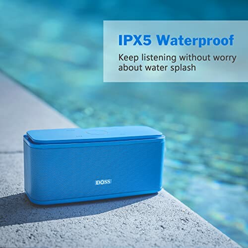 Blue waterproof Bluetooth speaker by a pool, IPX5 rating.
