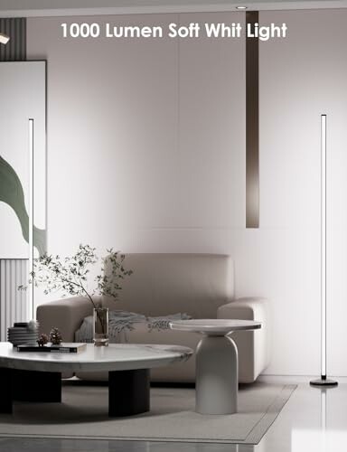 Modern living room with tall LED lights and minimal decor.
