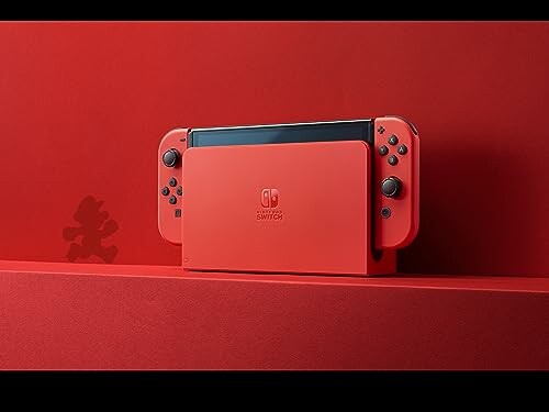 Red Nintendo Switch console with controllers