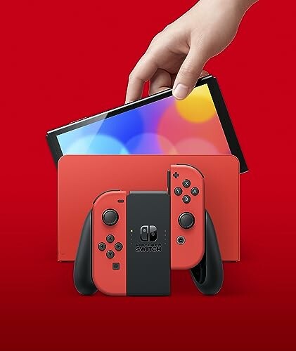 Hand placing Nintendo Switch into red dock.