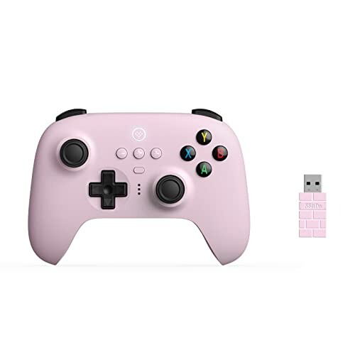 Pink wireless gaming controller with USB adapter.