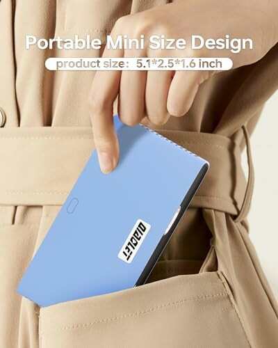 Person placing a small blue wallet into a jacket pocket.
